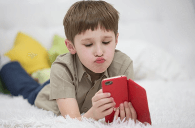 kid playing phone