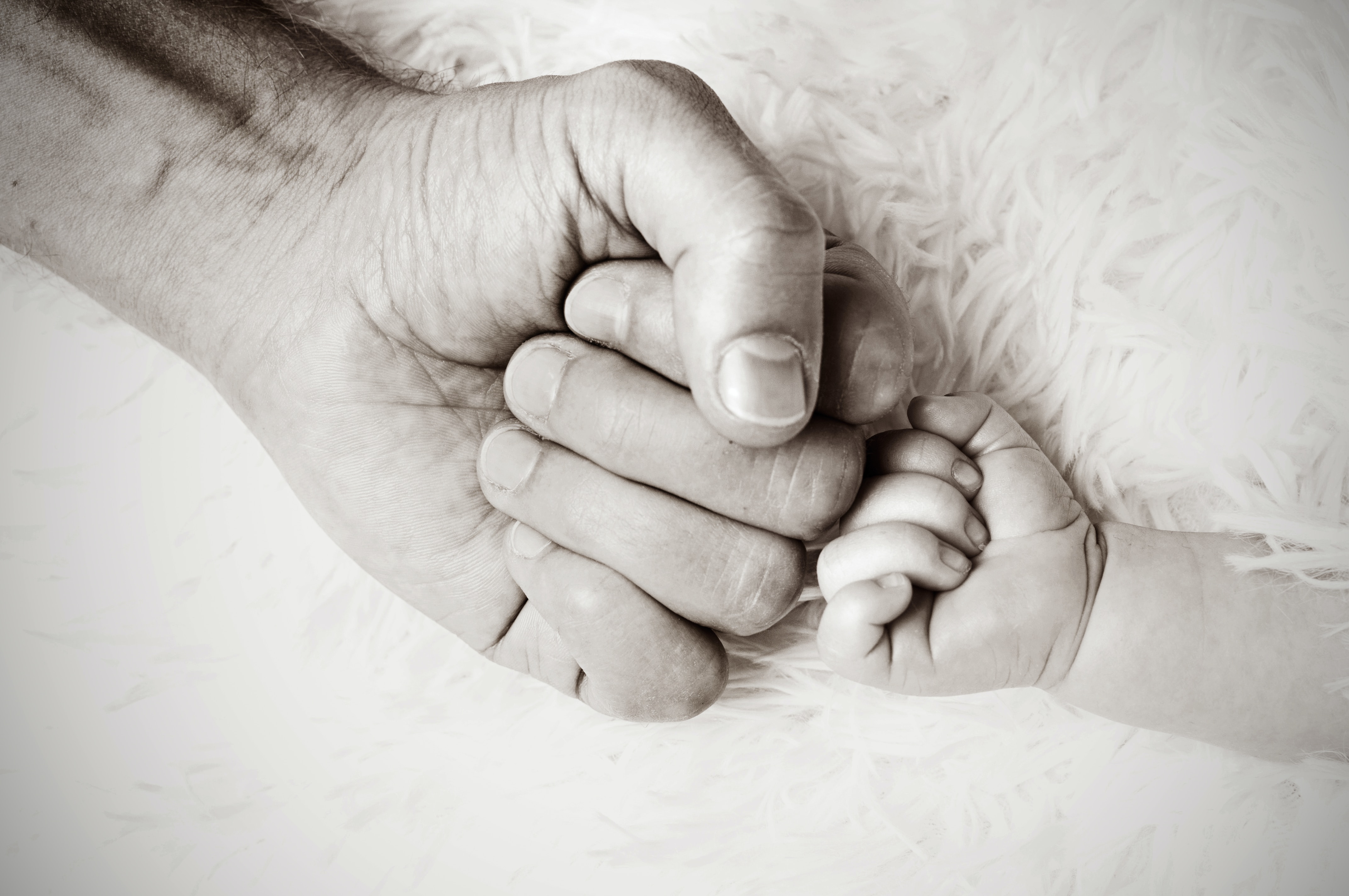 dad and baby fist bumping 