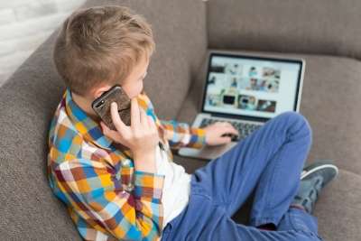 boy using his devices