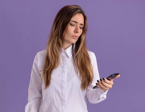 woman looking at her phone